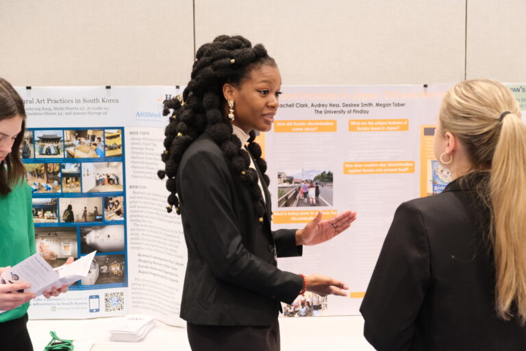 University of Findlay student Desiree Smith presents a descriptive poster about her research project in Japan, at the ASIANetwork conference. (2024)