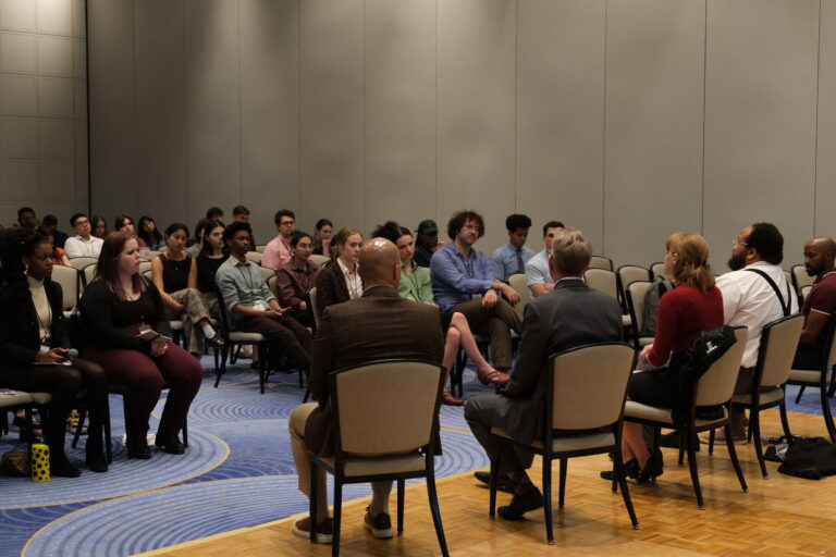 Panel speaking to students