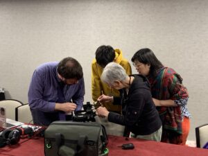 Workshop participants learn to operate a digital video camera for oral history interviews.