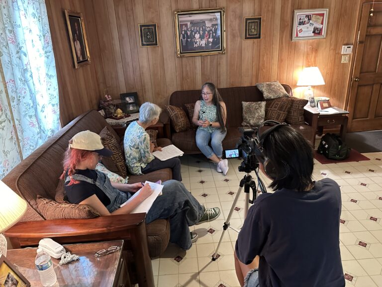 Community historian Emerald Dunn and students interview a community member as part of the Arkansas Chinese Heritage Project.