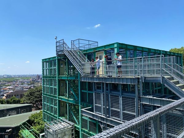 Students observing chimpanzees at Kyoto University’s Center for Evolutionary Origins of Human Behavior in Inuyama Japan.