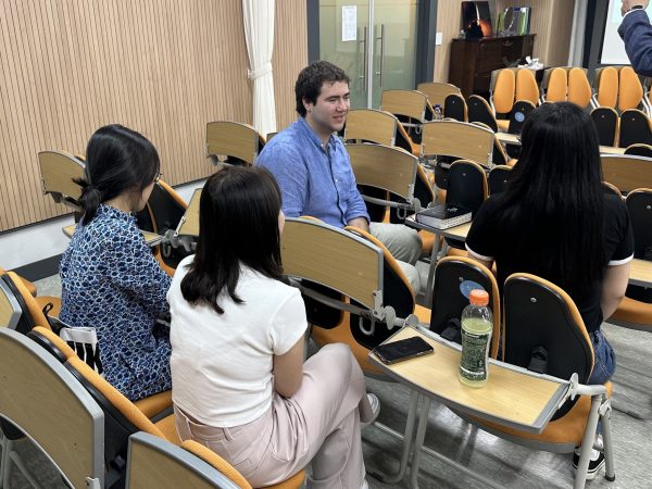 Conversation with North Korean interlocutors
(Pictured: Skidmore student Tucker Obering '24 is engaged in conversation with North Korean interlocutors.)